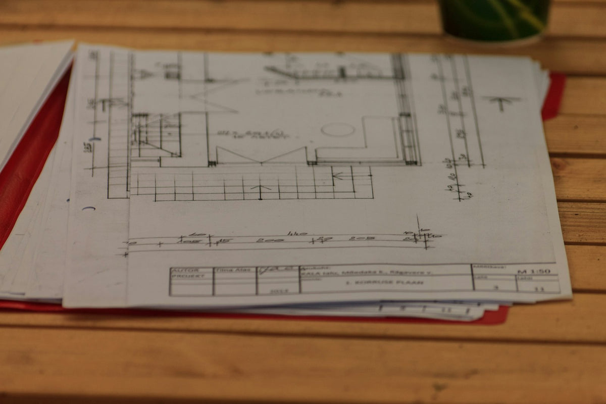 Architecture plans spread on a table